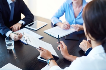 a group of people sitting around a table