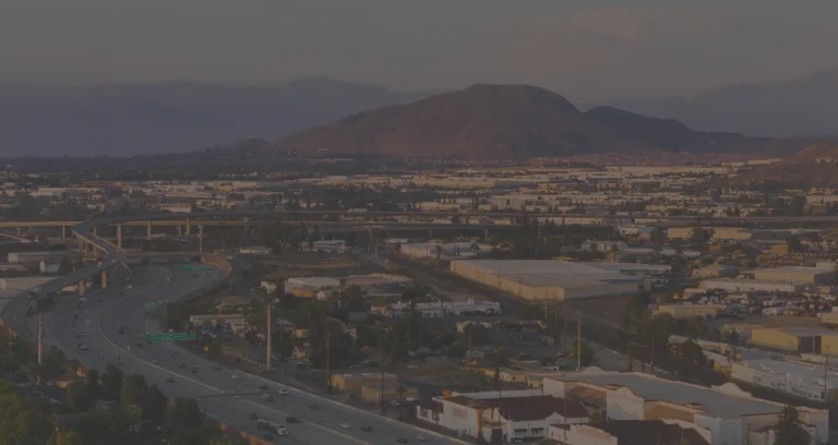 a city with a mountain in the background