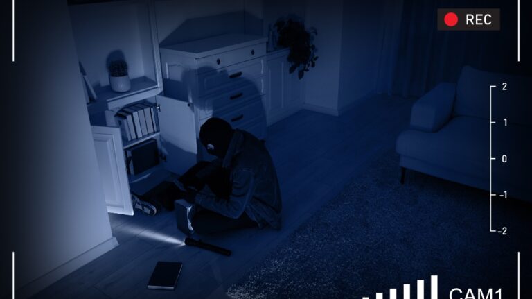 Thief robbing house, view through surveillance camera