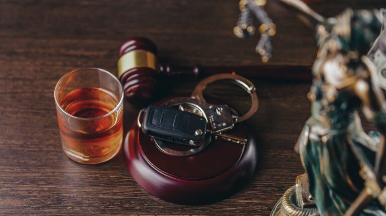 Whiskey with car keys and handcuffs