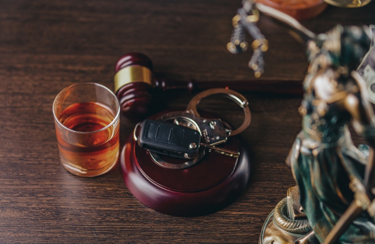 Whiskey with car keys and handcuffs