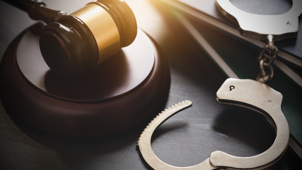 Handcuffs and judge's gavel