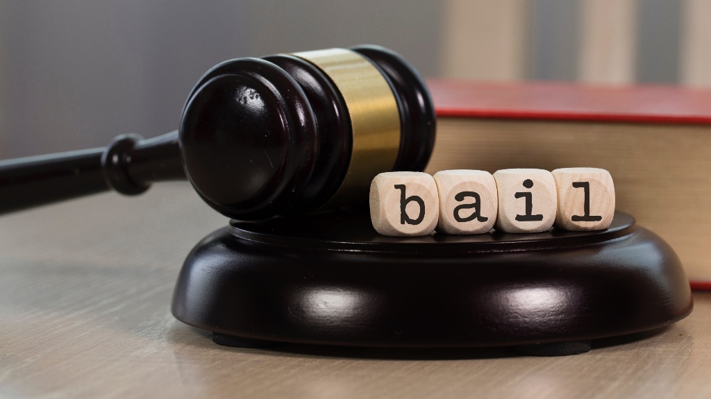 Word Bail composed of wooden blocks and judge's gavel
