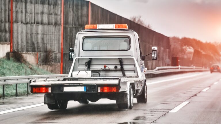 Empty flatbed tow carrier truck